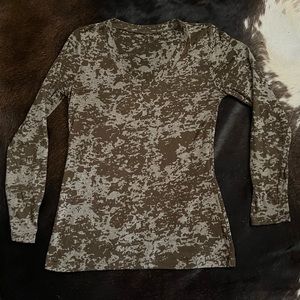 Olive green and white long sleeve V neck shirt.